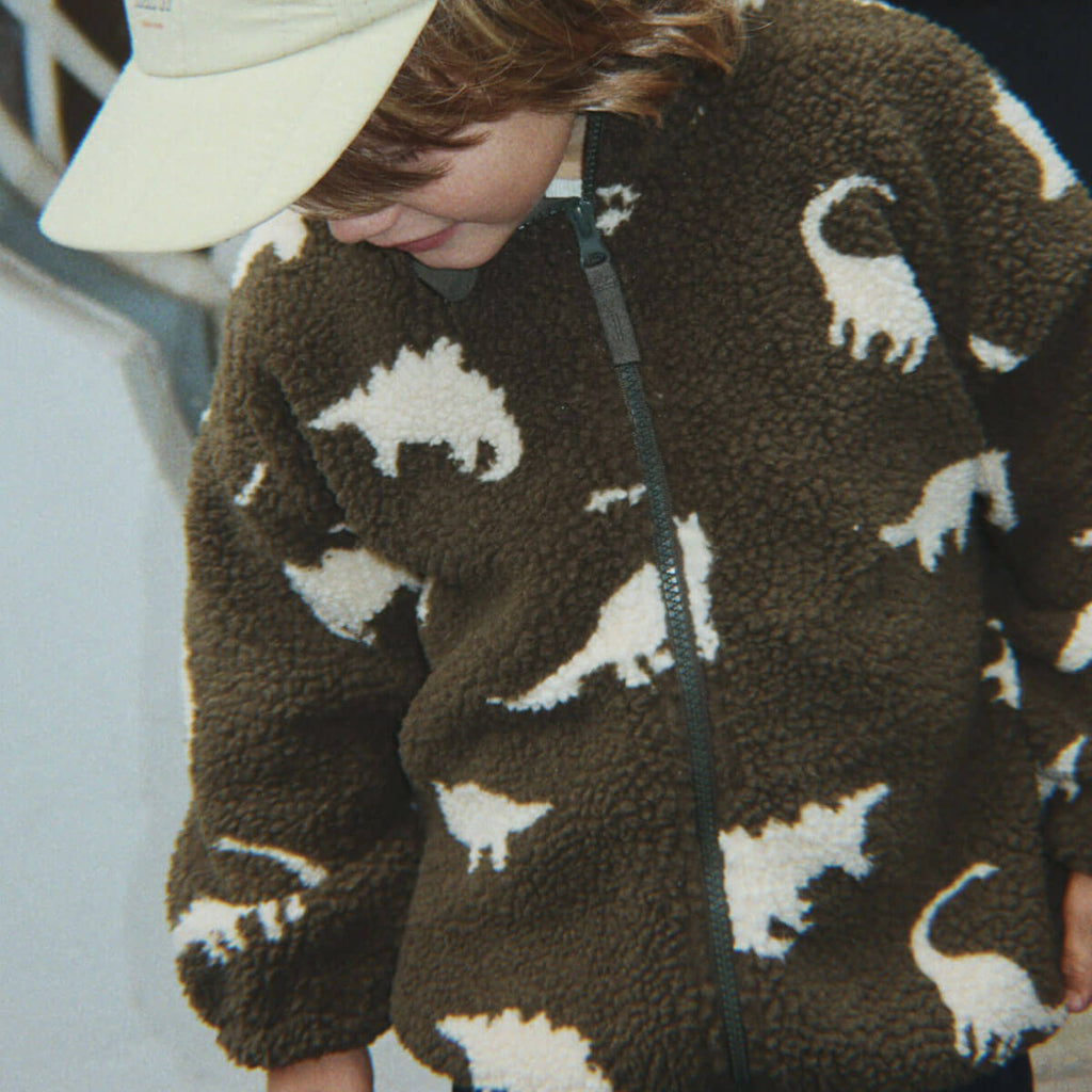 Veste polaire "Pile" avec silhouette dinosaure sarcelle, col montant et poignets élastiqués pour enfant, idéale pour la mi-saison