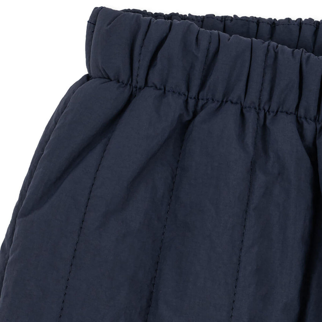 Pantalon matelassé en nylon marine foncé résistant au vent avec taille élastique et guêtres tempête pour enfants (vêtements d'extérieur)