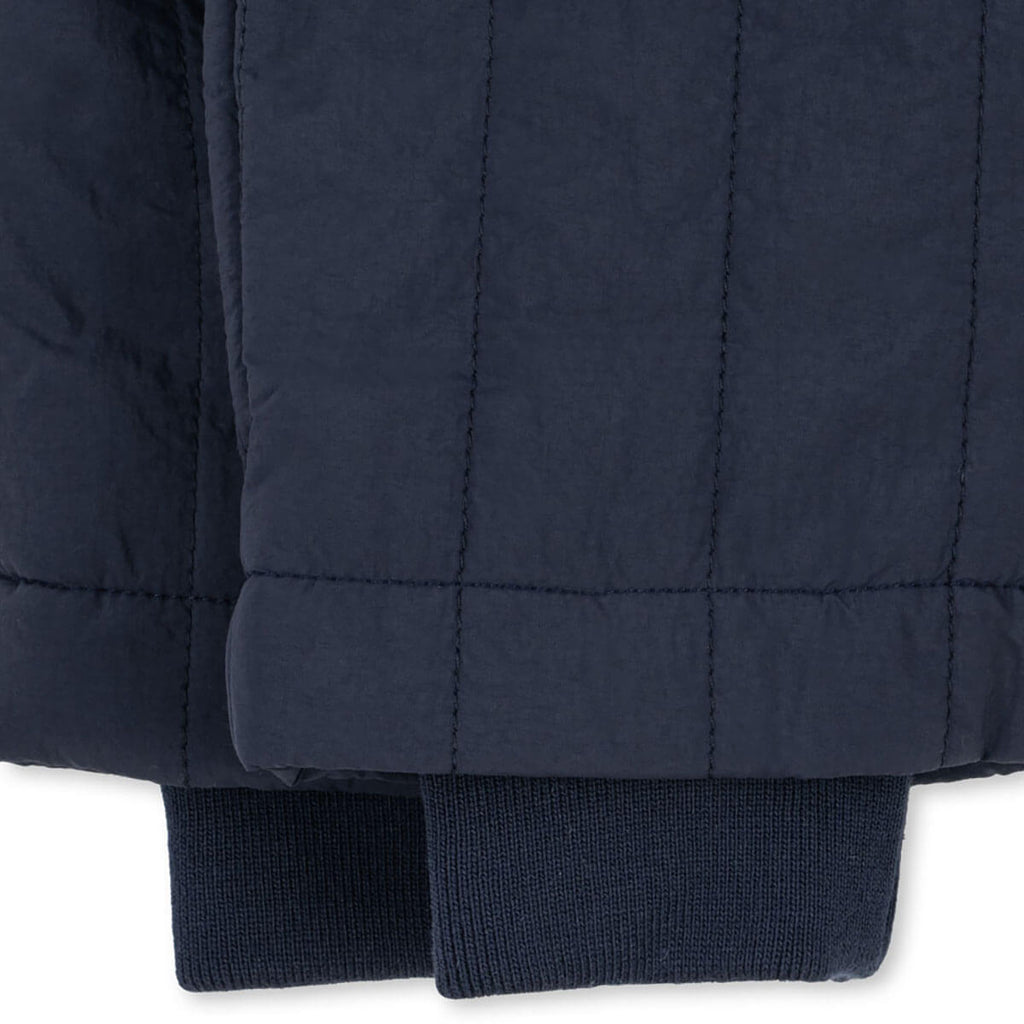 Pantalon matelassé en nylon marine foncé résistant au vent avec taille élastique et guêtres tempête pour enfants (vêtements d'extérieur)