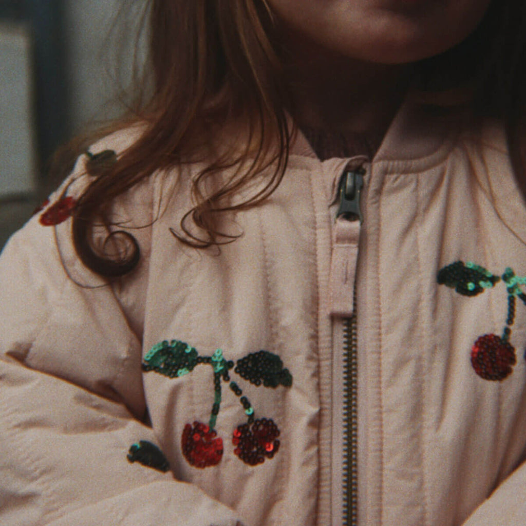Blouson aviateur en nylon rose à sequins au dos avec rembourrage en polyester et finition coupe-vent pour enfants