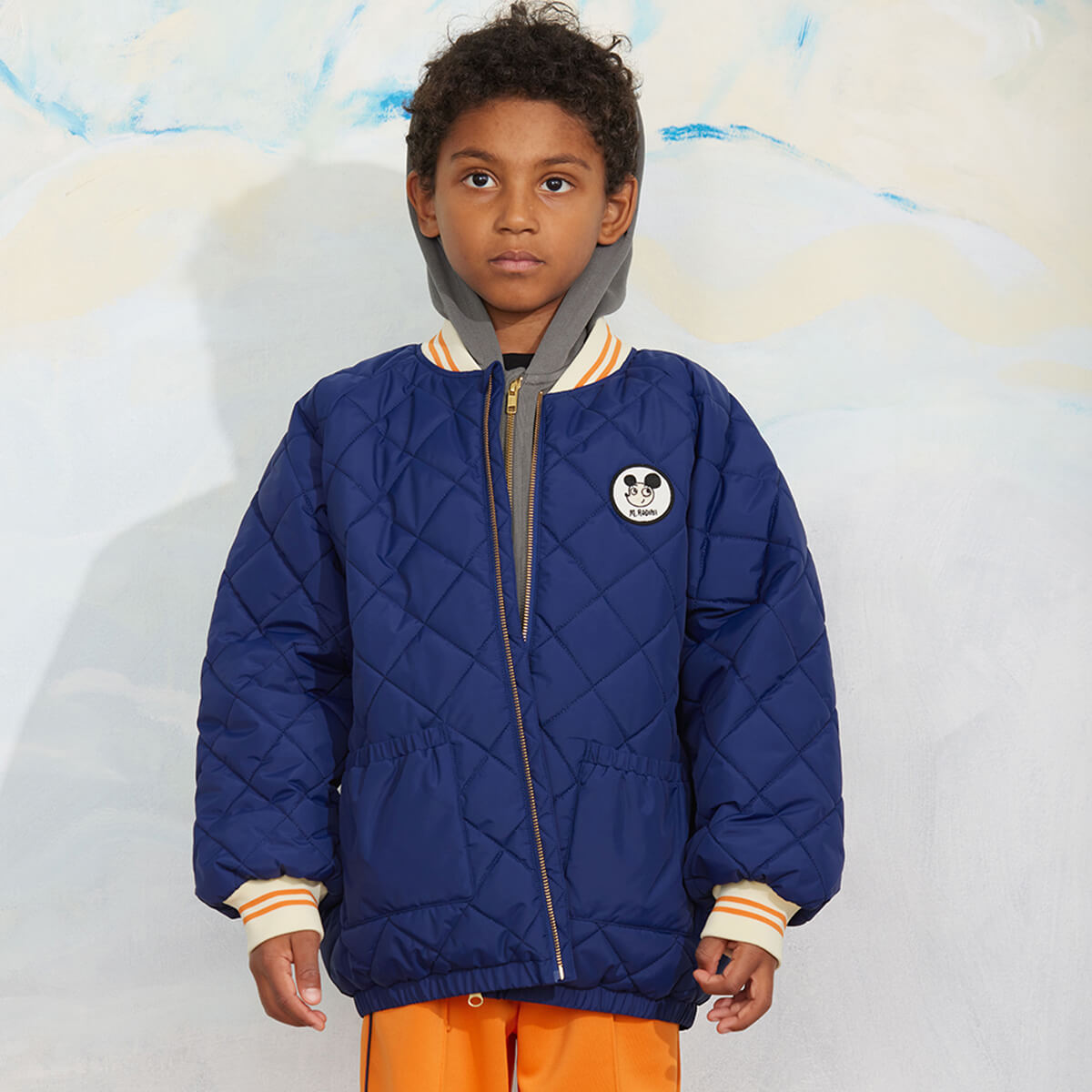 Doudoune matelassée en polyester recyclé à imprimé patchwork bleu avec poignets côtelés pour enfants au quotidien