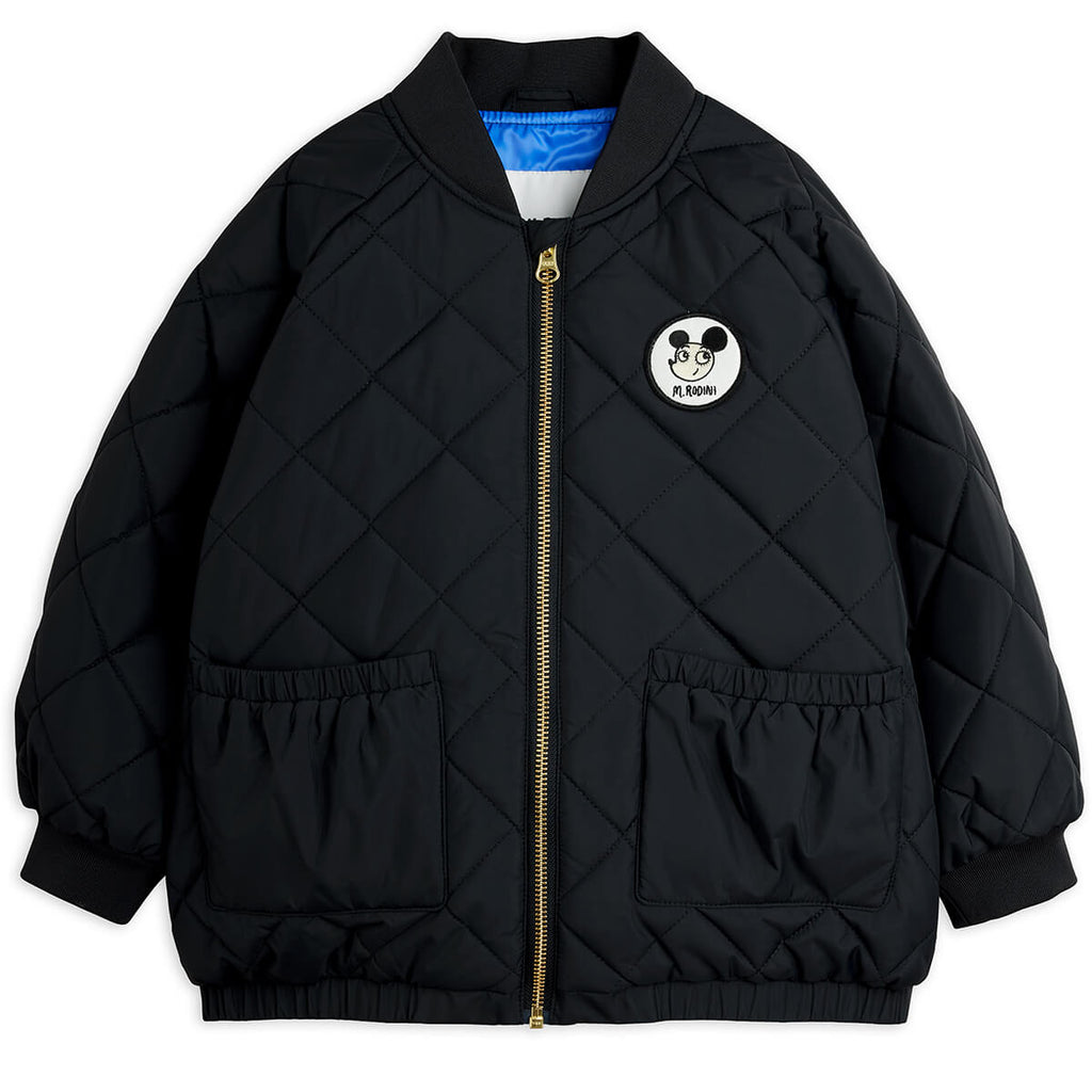 Doudoune matelassée en polyester recyclé à imprimé patchwork noir avec poignets côtelés pour enfants usage quotidien