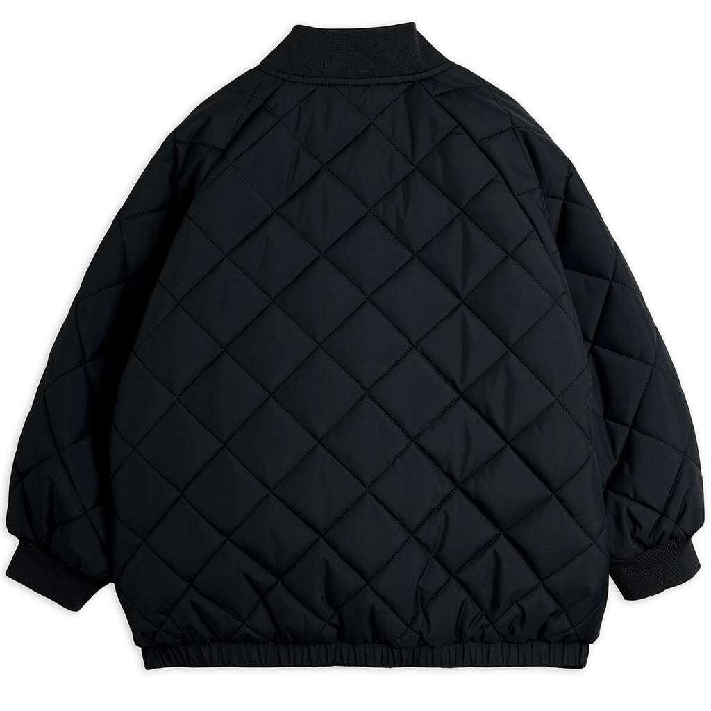 Doudoune matelassée en polyester recyclé à imprimé patchwork noir avec poignets côtelés pour enfants usage quotidien
