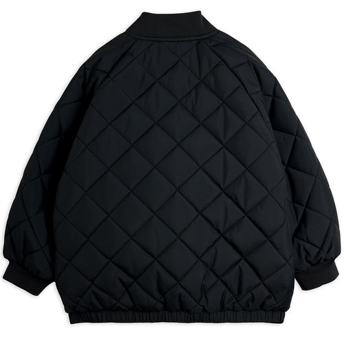 Doudoune matelassée en polyester recyclé à imprimé patchwork noir avec poignets côtelés pour enfants usage quotidien