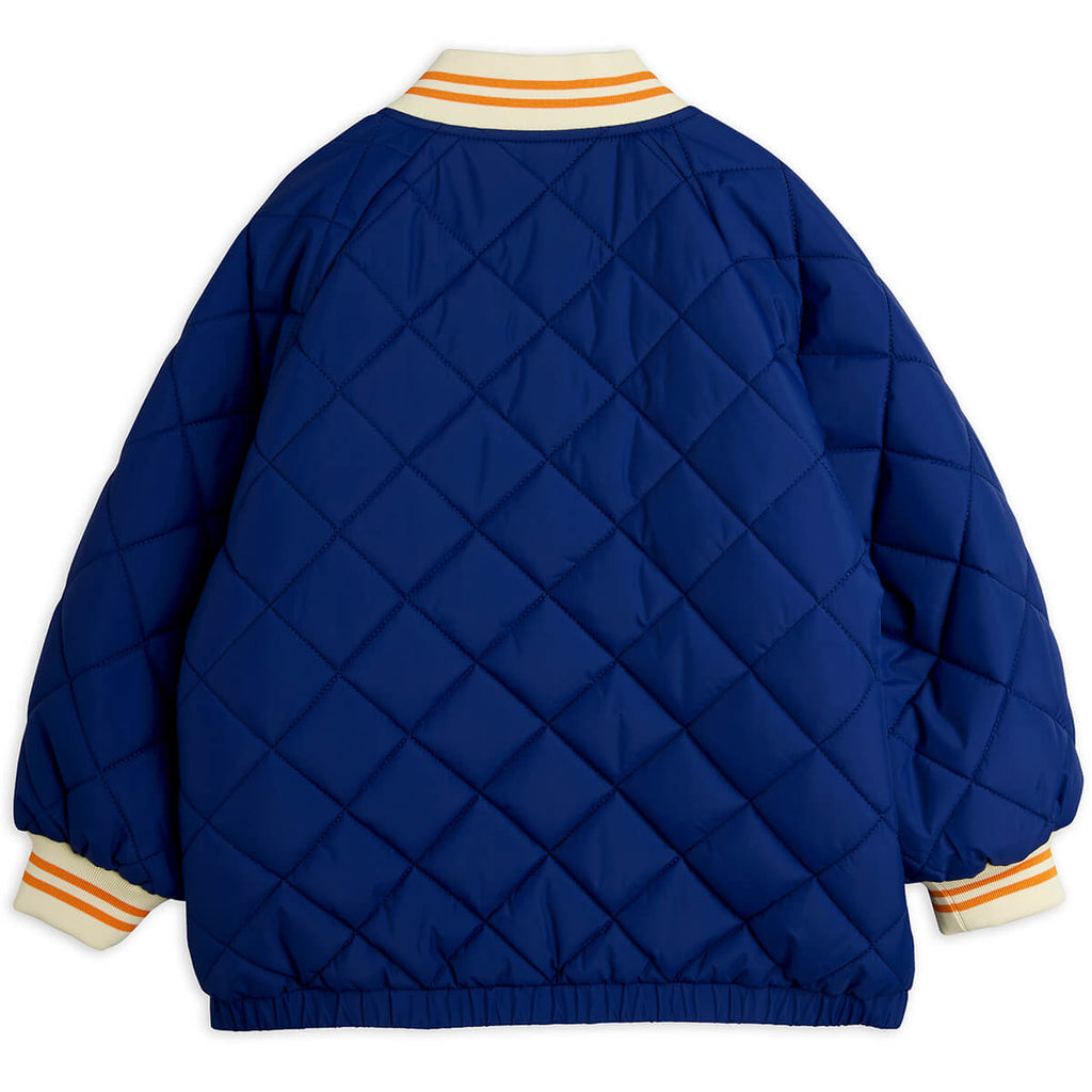 Doudoune matelassée en polyester recyclé à imprimé patchwork bleu avec poignets côtelés pour enfants au quotidien